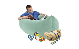 Child reading on soft seating.